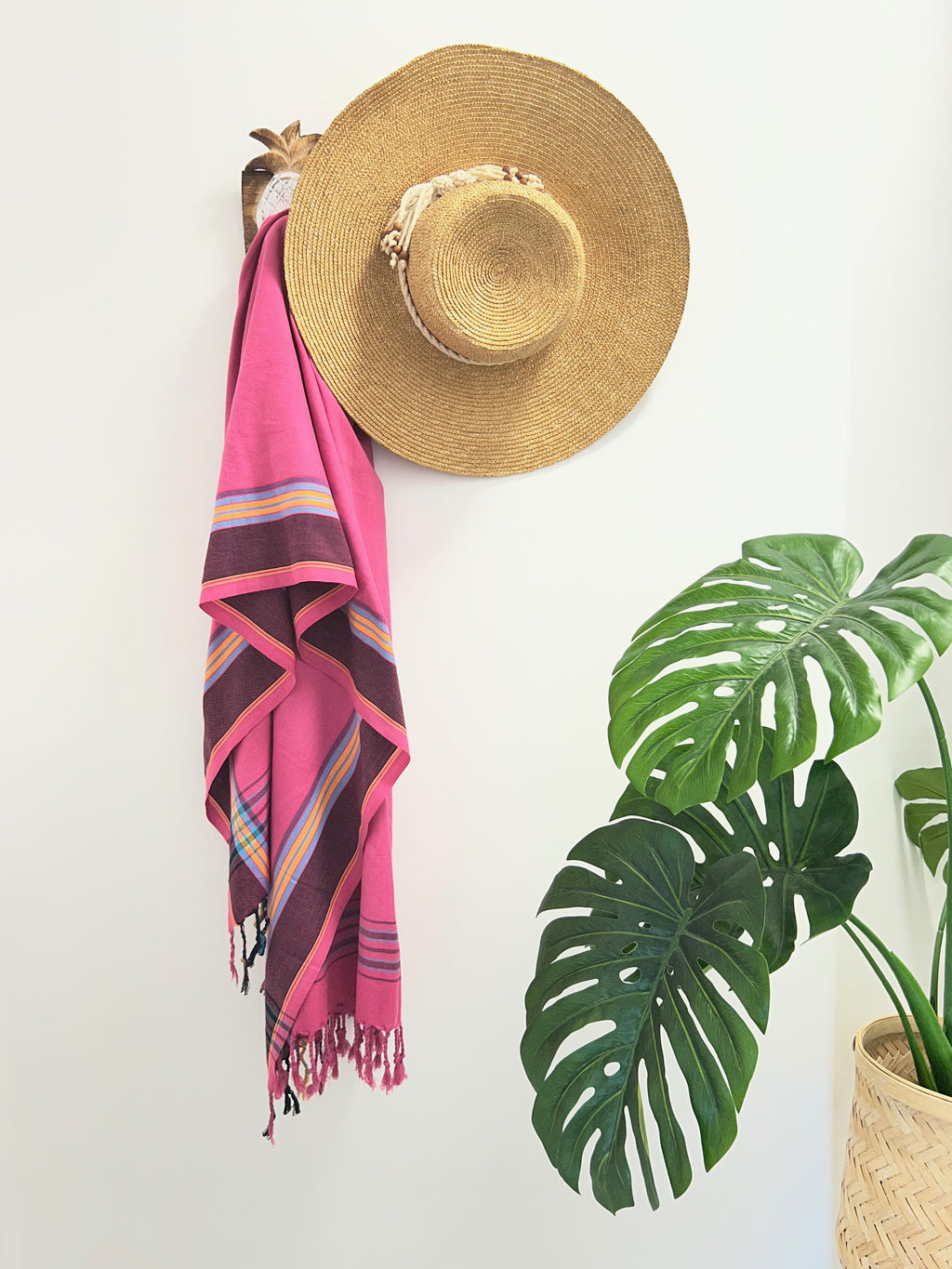 Coral Cream & Black Throw Rug on wall hook with straw hat