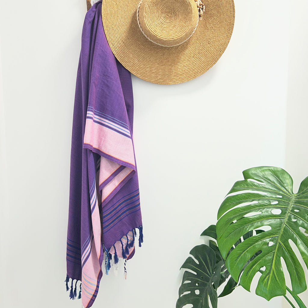 Pink Navy & Purple Throw Rug on wall hook with straw hat