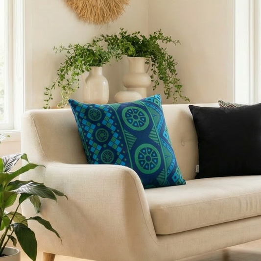 Living room with a beige sofa, decorative pillows, and a coffee table.