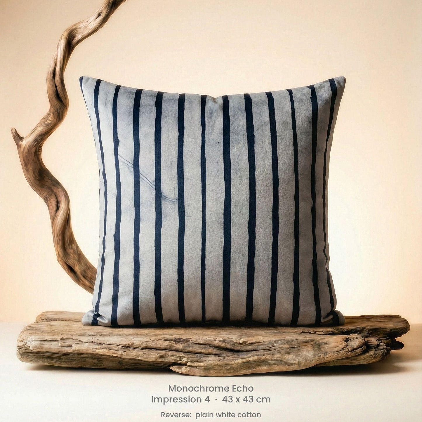 Decorative cushion with black and white stripe on driftwood with a neutral background