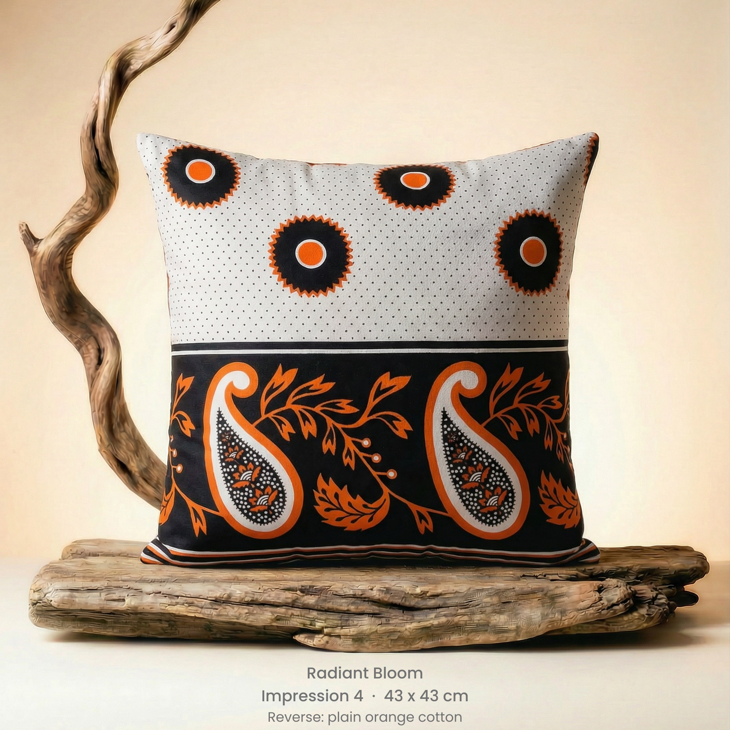 Decorative pillow with paisley pattern on a wooden stand against a beige background