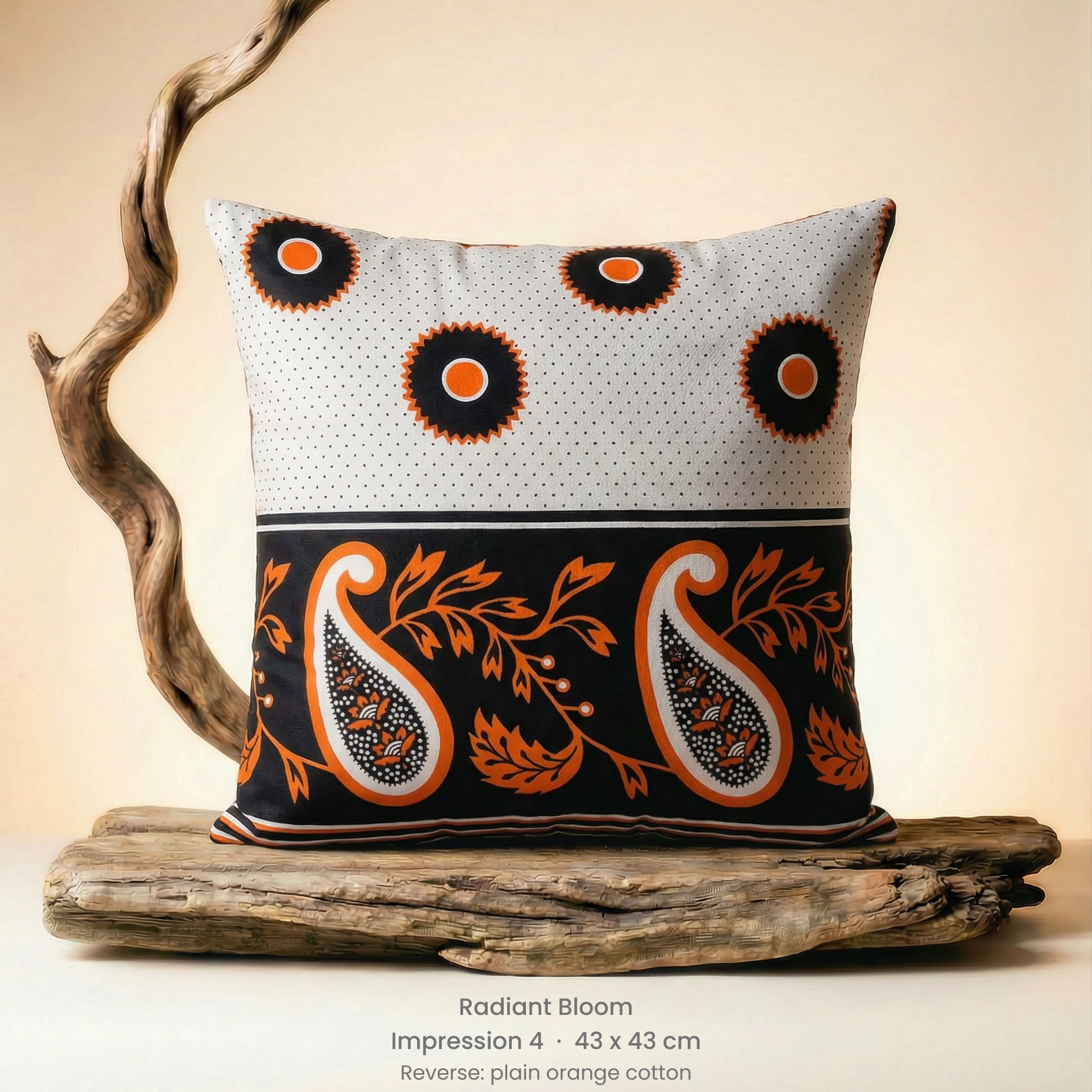Decorative pillow with paisley pattern on a wooden stand against a beige background