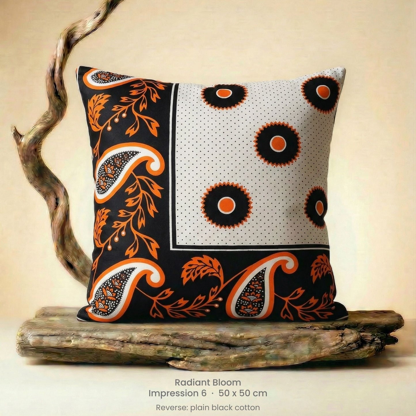 Decorative cushion with orange, black and white pattern on driftwood with a neutral background.
