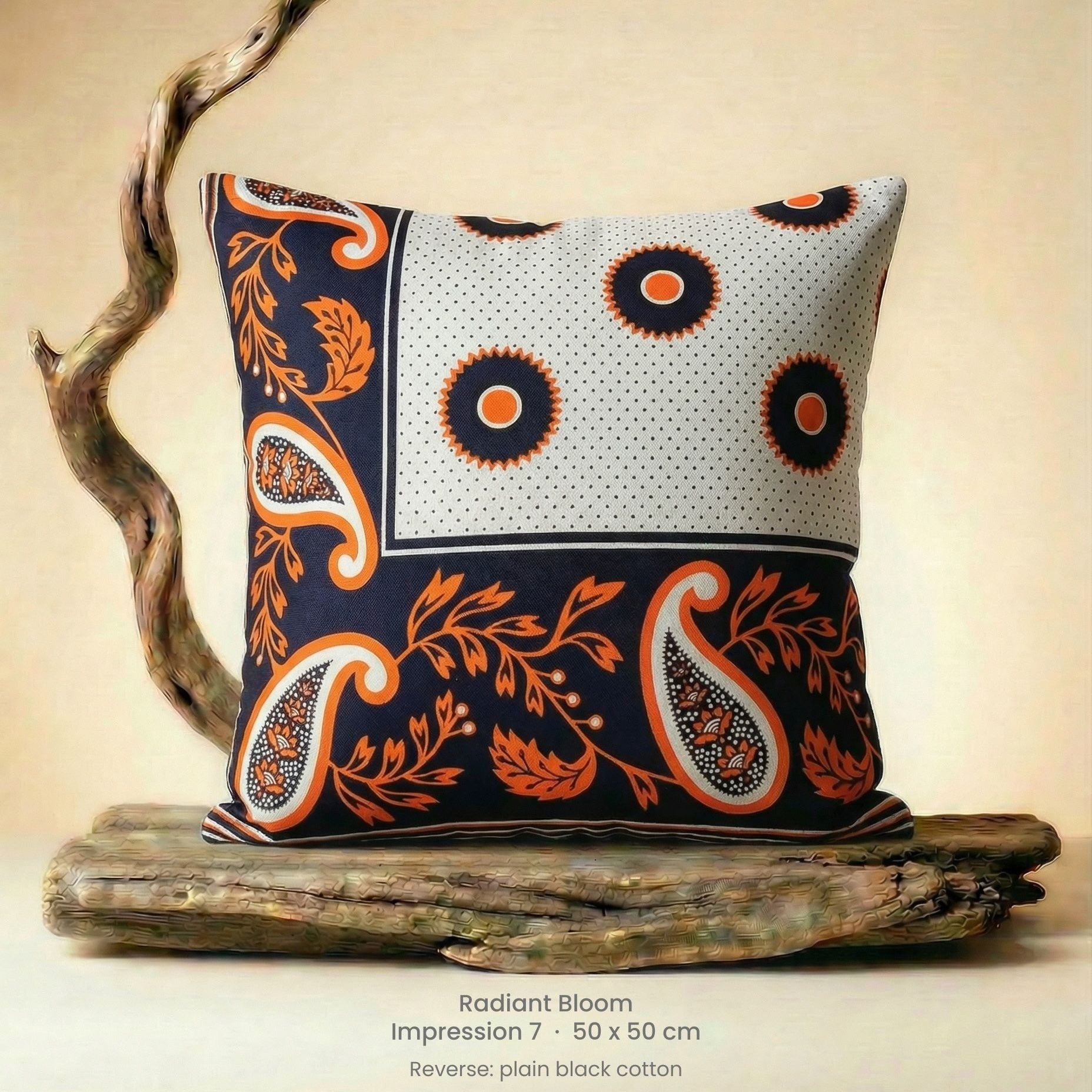 Decorative cushion with orange, black and white pattern on driftwood with a neutral background.