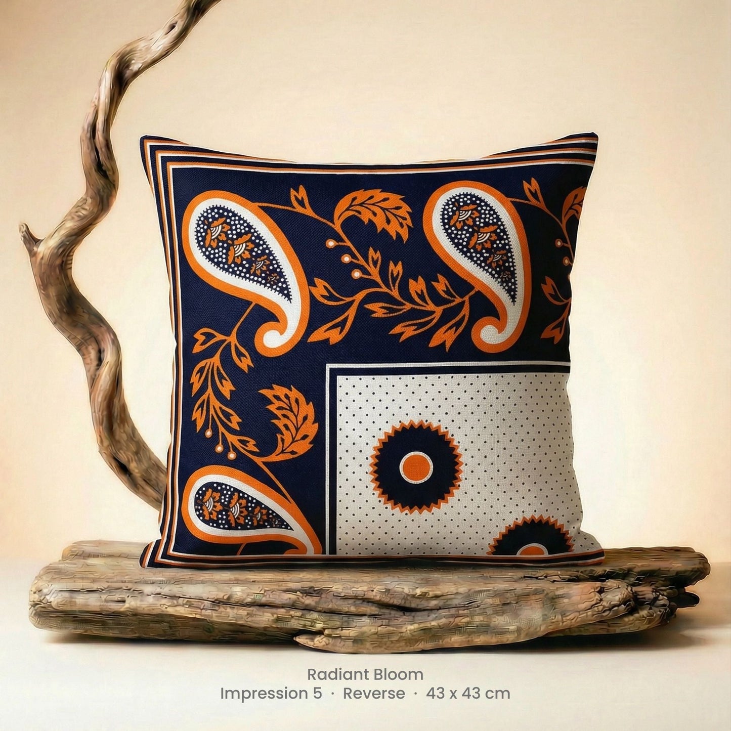 Decorative cushion with orange, black and white pattern on driftwood with a neutral background.