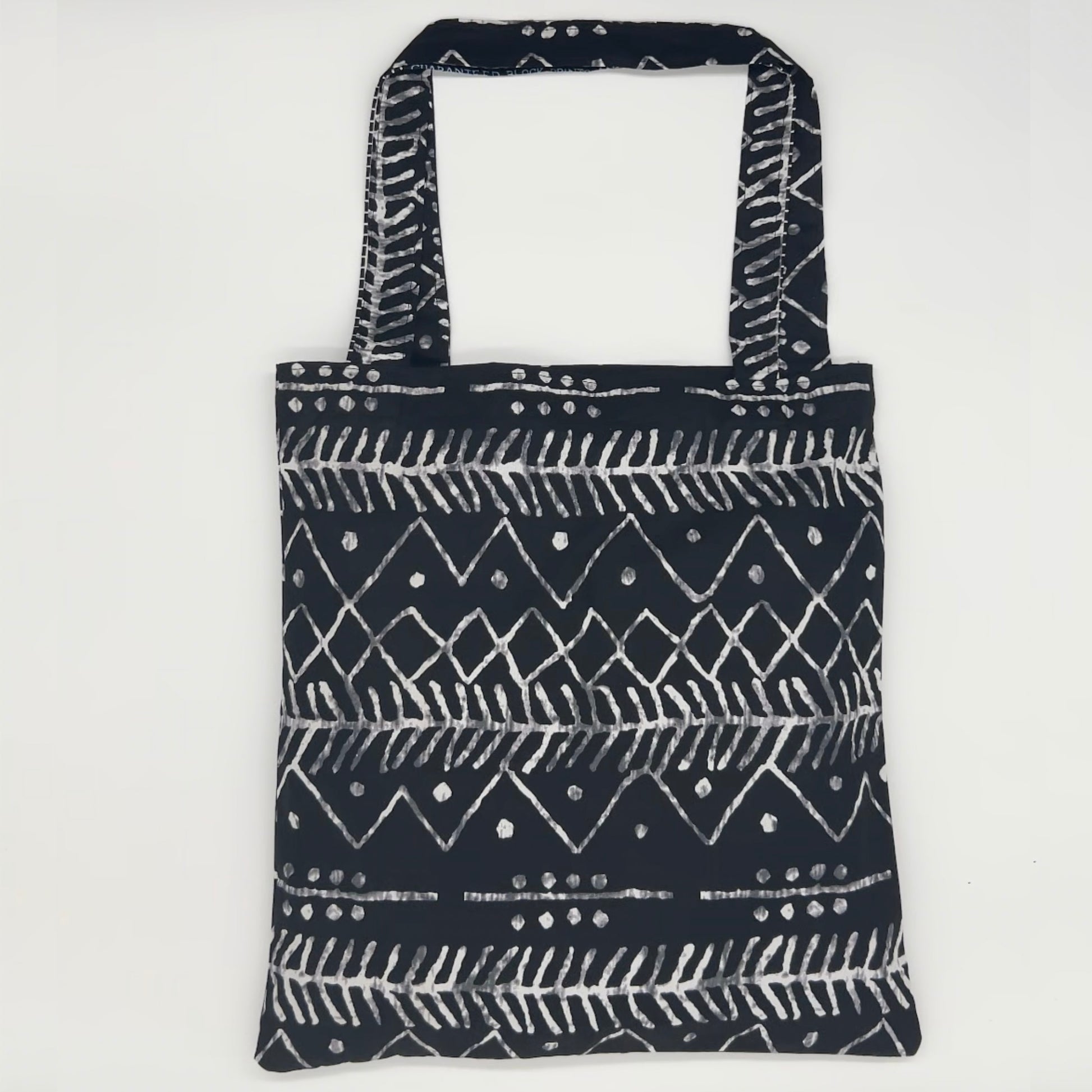 Black and white tote bag on a white background