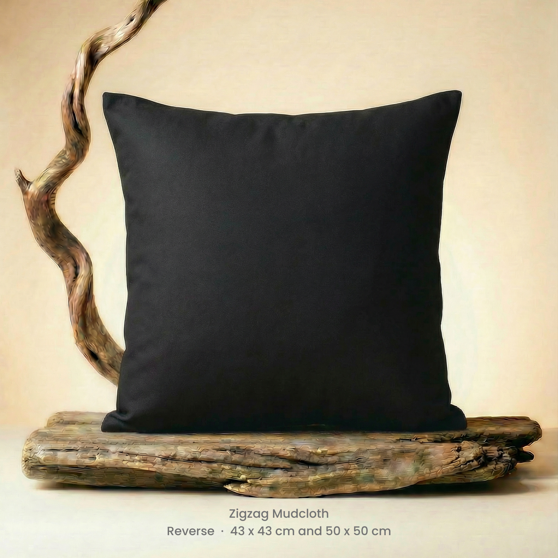Black pillow on a wooden platform with a neutral background